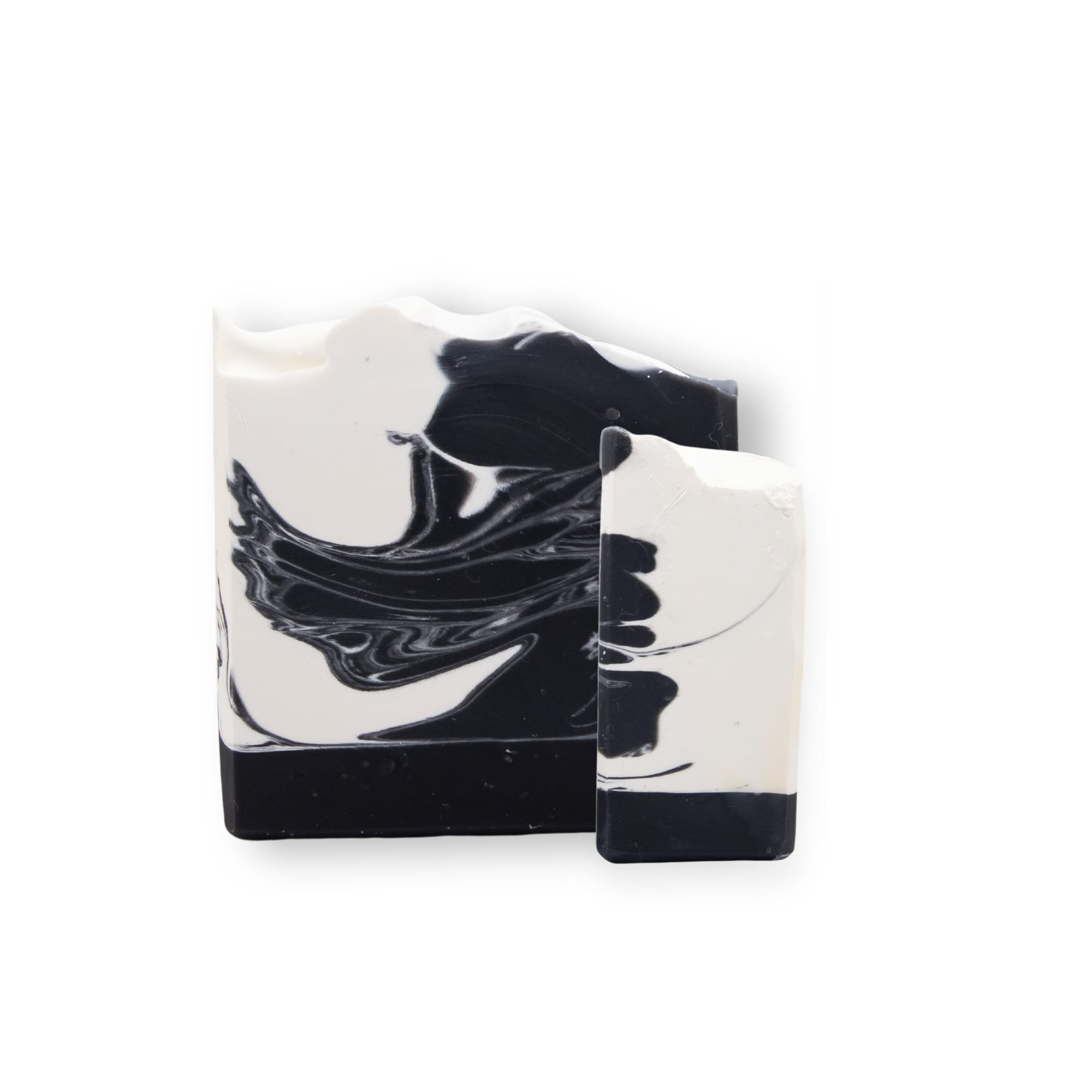 Jabón artesanal con carbón activado, árbol de té y limón. Limpieza profunda que purifica y revitaliza la piel.